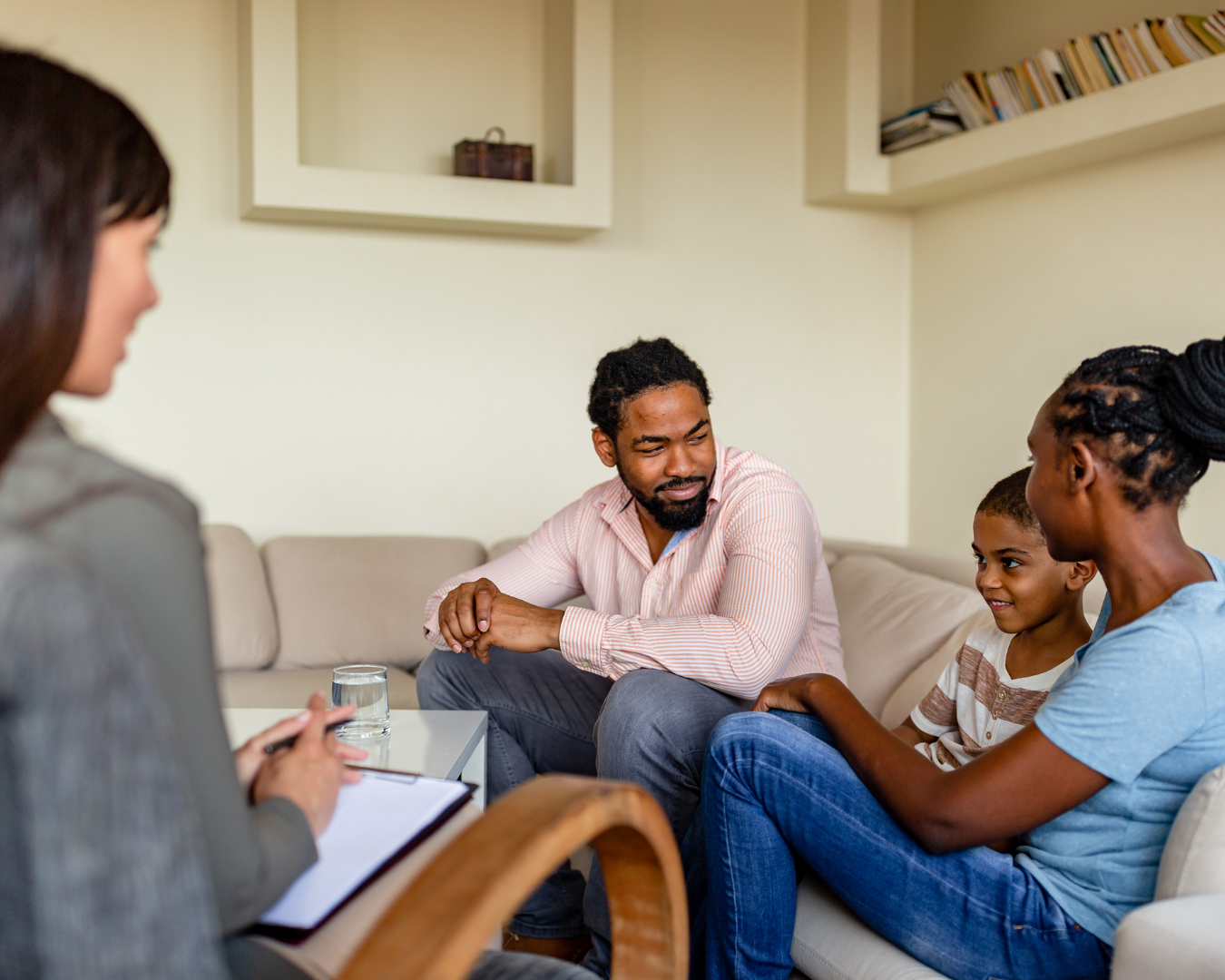 Parent and teen in a supportive therapy consultation focused on peak performance stress